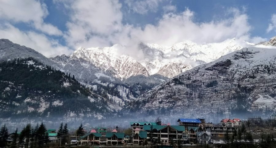 Manali town among pine forests and snow peaks